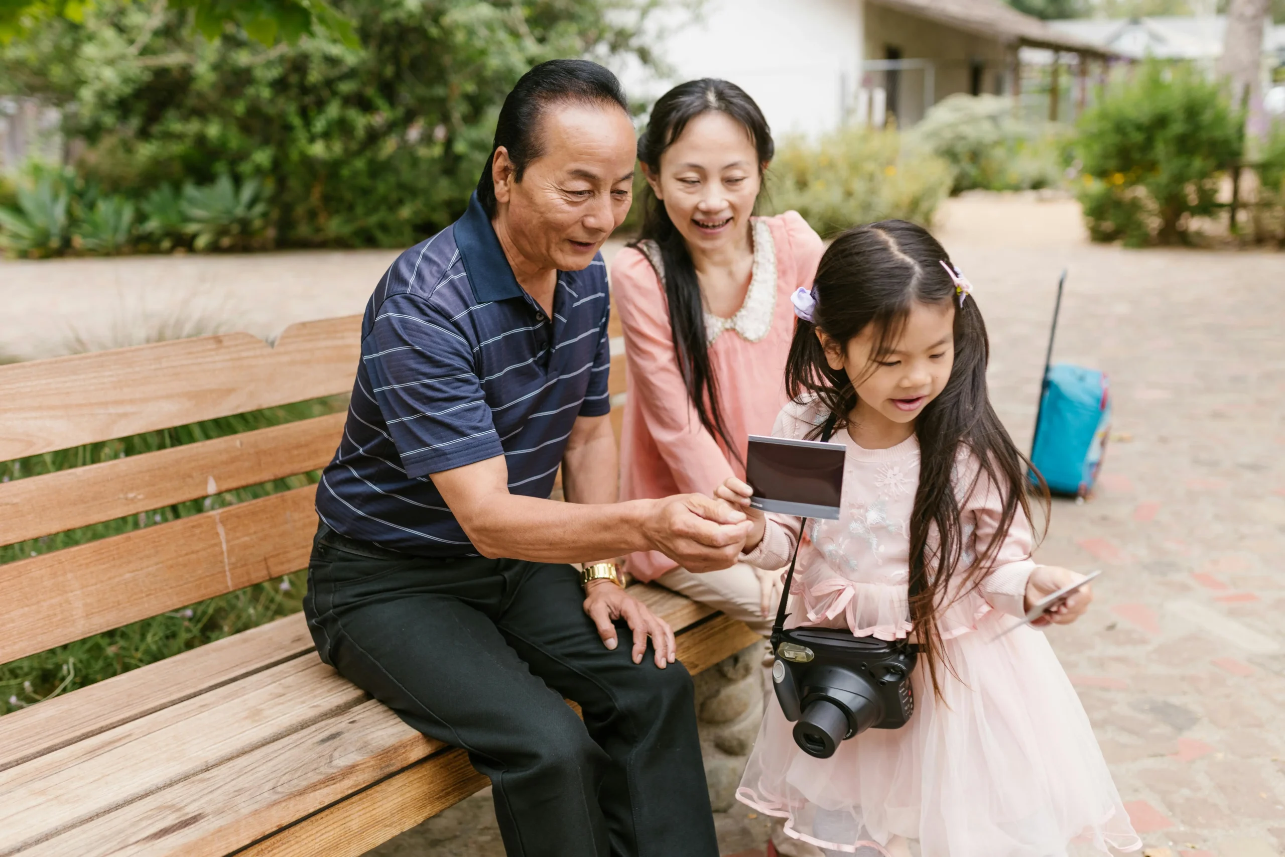 A family with their child using speech therapy tools