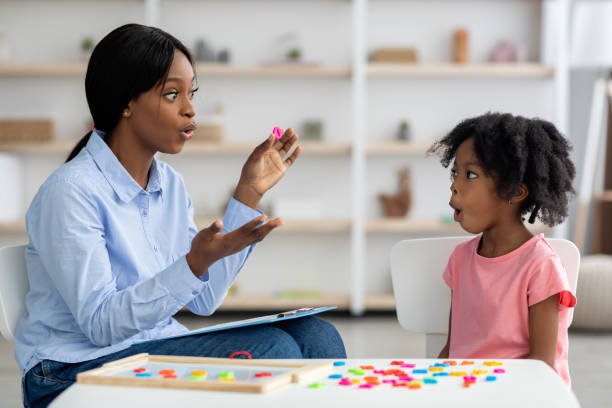 A girl having a speech therapy session with an expert